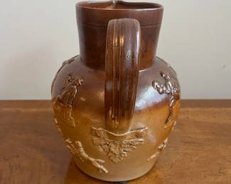 C79 - $40. 19th Century Royal Doulton Lambeth Pitcher. Salt Glazed. Measures 8.5" tall. 1 very minor chip on the top rim. 