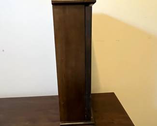 C102 - $40. Regulator Clock. Measures 12.5" wide x 5.25" deep x 19" tall. Has key and pendulum inside. Works!