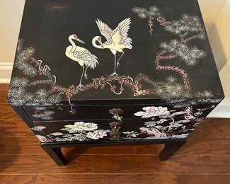 C35 - $125. Black Lacquered Chest on Stand. Cranes on the top and floral pattern around. Measures 16" wide x 11" deep x 23" tall. 3 drawers slide easily. No issues noted. 