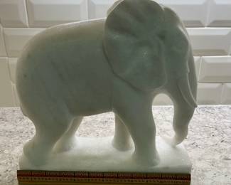 C87 - $100. Marble Elephant Statue. Measures 12" long x 4.5" x 12.5" tall. One tusk is broken but HEAVY. 