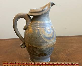 C40 - $25. Heavy Pottery Pitcher. Measures 10.25" tall. 