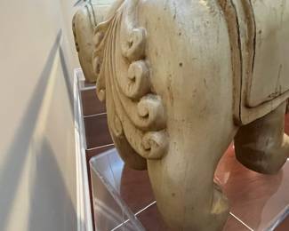 C42 - $450. Foo Dog Side Table. Glass top with lucite bases. Measures 66" x 15" deep x 28.5" tall. Dogs are porcelain material. 