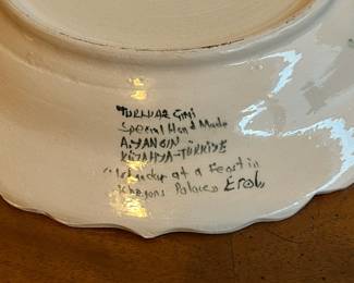 C60 - $30. Vintage Hand Painted Turkish Plate. Signed "Islander at a feast in Khagons Palaces Erol" Measures 12.75" diameter. 