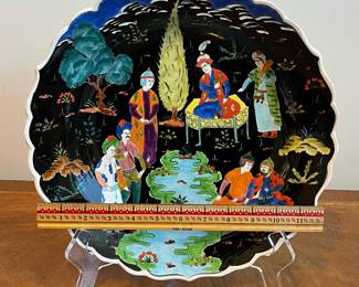 C60 - $30. Vintage Hand Painted Turkish Plate. Signed "Islander at a feast in Khagons Palaces Erol" Measures 12.75" diameter. 