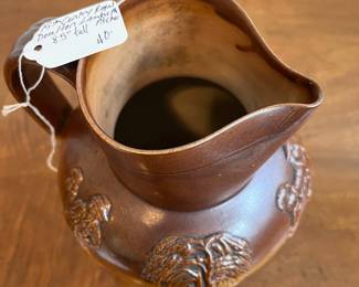 C79 - $40. 19th Century Royal Doulton Lambeth Pitcher. Salt Glazed. Measures 8.5" tall. 1 very minor chip on the top rim. 