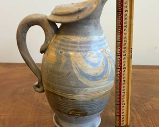 C40 - $25. Heavy Pottery Pitcher. Measures 10.25" tall. 