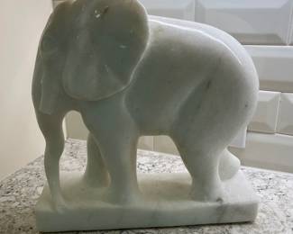 C87 - $100. Marble Elephant Statue. Measures 12" long x 4.5" x 12.5" tall. One tusk is broken but HEAVY. 
