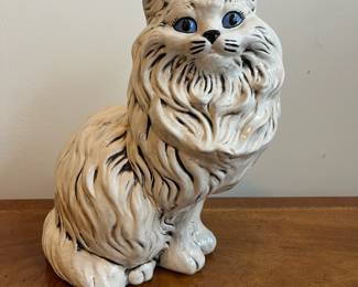 C75 - $35. Porcelain Cat Statue. Measures 14" tall. 