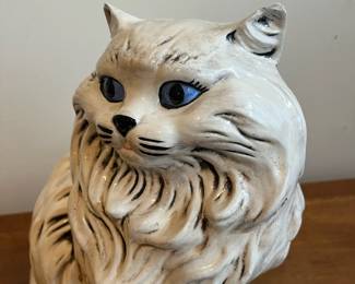 C75 - $35. Porcelain Cat Statue. Measures 14" tall. 
