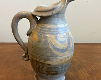 C40 - $25. Heavy Pottery Pitcher. Measures 10.25" tall. 