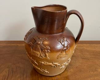 C79 - $40. 19th Century Royal Doulton Lambeth Pitcher. Salt Glazed. Measures 8.5" tall. 1 very minor chip on the top rim. 