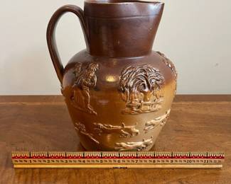 C79 - $40. 19th Century Royal Doulton Lambeth Pitcher. Salt Glazed. Measures 8.5" tall. 1 very minor chip on the top rim. 