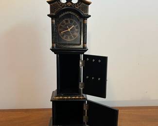 C33 - $30. Battery Powered Desk Clock/Jewelry Box.  Measures 6.25" wide x 4" deep x 23.5" tall. Middle & Bottom section open with felt lining. 