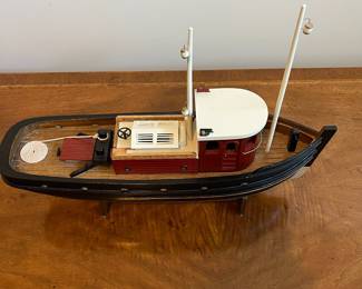 C25 - $30. Decorative Wooden Boat. Measures 20" long x 6" wide x 15" tall. 