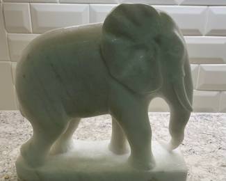 C87 - $100. Marble Elephant Statue. Measures 12" long x 4.5" x 12.5" tall. One tusk is broken but HEAVY. 