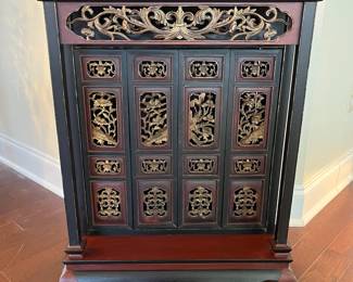 C49 - $150. Small 4 door Asian Cabinet. Lacquered Finish black & red. Measures 21" wide x 12.75" deep x 27.5" tall. 