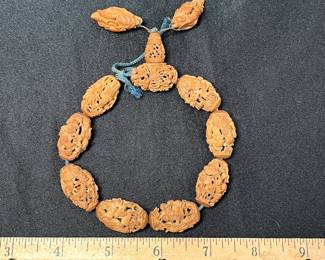 C113 - $2000. 19th Century Chinese Heido Carved Fruit Pits on Bracelet. Qing Dynasty 1850s. 12 Beads. 