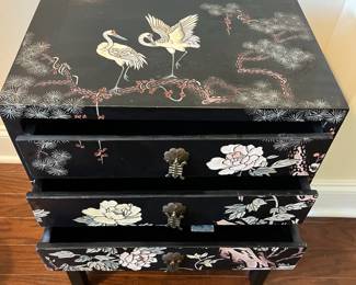 C35 - $125. Black Lacquered Chest on Stand. Cranes on the top and floral pattern around. Measures 16" wide x 11" deep x 23" tall. 3 drawers slide easily. No issues noted. 