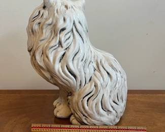 C75 - $35. Porcelain Cat Statue. Measures 14" tall. 