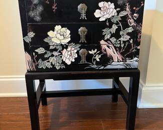 C35 - $125. Black Lacquered Chest on Stand. Cranes on the top and floral pattern around. Measures 16" wide x 11" deep x 23" tall. 3 drawers slide easily. No issues noted. 