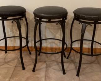 Three Backless Swivel Bar Stools with Brown Leather Seat and Brown Metal Frame