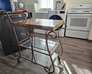 Tea cart with faux marble top.