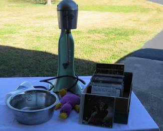 Antique milkshake machine, CD's, metal dog bowl and plush toy.