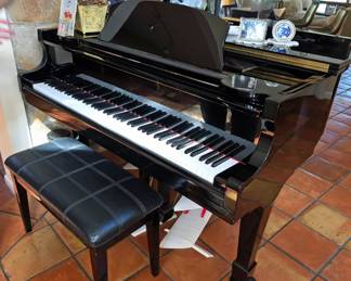 Schumann baby grand piano, subject to pre-sale.