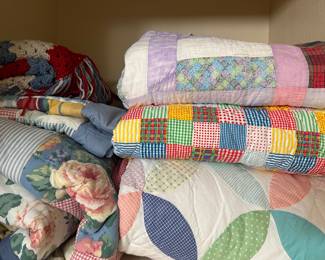 Right: 
Handmade Floursack Quilt (will be hanging on a wall quilt rack during the sale)
Handmade/pieced together primary color quilt
Hand pieced, but possibly machine wedding ring quilt

Left: 
Crochet blanket
Full/Queen Size Bedding 1990s named “Rebecca” Ralph Lauren or Tommy Hilfiger? 2 shams and comforter. Red sheets will also be available
