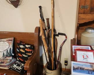 Canes and Walking Sticks and a large Crock