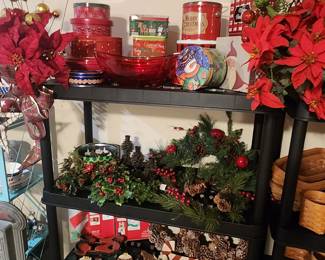 Christmas greenery, candle centerpieces and tins