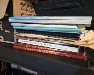 Clock Repair Books and a box of clock parts