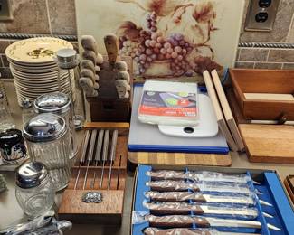 Knives, cutting boards. Restaurant style sugar and pepper dispenser set. 