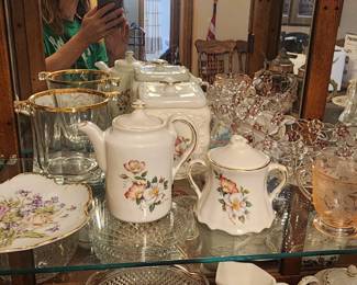 Crystal Oval bowl with raspberry colored accents,  peach glass cup, and porcelain items
