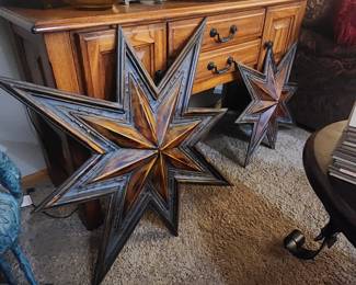 Star shaped metal wall medallions and a Gorgeous Console table
