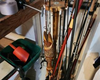 Wood Fishing pole holder with a carved wooden fish