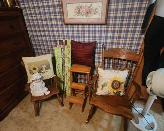 Vintage Rockers with leather seats, wooden stool with fold-up steps, throw pillows. Porcelain doll.