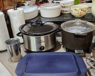 Glass Pyrex casserole dish with lid, Crock pot, Paper Towel holders. 