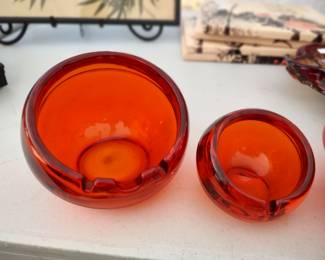 pair mid-century orange glass ashtrays