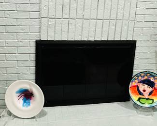 Whimsical Mantle Features a Selection of Art Glass, Ceramic and Metal Art.