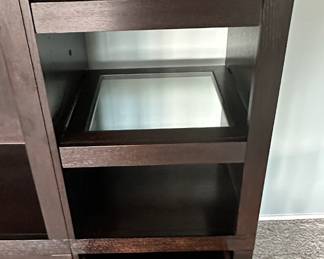 Detail View of the Gorman Media Center with Glass Insert Shelves and Pull Out Drawers.