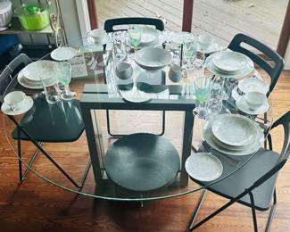 Gorgeous Contemporary Glass Top on Brushed Metal and Wood Accent Dining Table and Black Chairs.