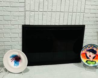 Whimsical Decor on the Mantle Features a Selection of Art Glass, Ceramic and Metal Art.