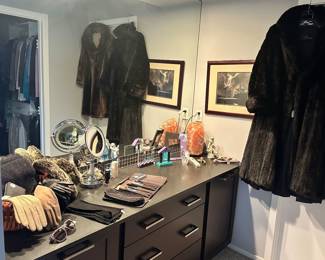 Great Vanity in the Primary Suite Housing Wonderful Gloves, Makeup Brushes and More.