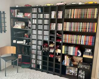 Displayed on a Collection of Black Independent Shelves you'll find an Eclectic CD Collection, Die Cast Cars, Upscale Men's Scarves, Books and More! Exterior Shelves Measure: 31.5"W x 11"D x 79"H.  The 5 Interior Adjustable "Cube" Shelves are Each 7.75"W.