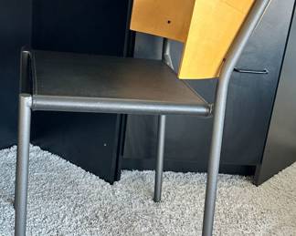 Side View of the Phillipe Starck (French, B. 1949), "Lila Hunter" Chair with Black Leather Seat.