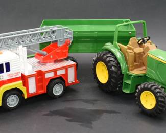 A Kid Galaxy Fire Ladder Truck and a John Deere Tractor with Trailer
