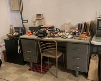 Heavy metal desk, office supplies, magnifying glasses