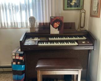 Organ, player piano music rolls, horn, sculpture of Chopin 