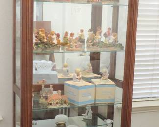 Lighted curio cabinet with sliding door